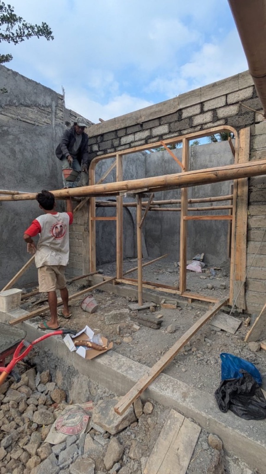 Crew working on walls and site carpentry